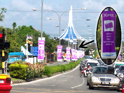 Celcom, Digi and Maxis banners are everywhere in the streets of Kuching